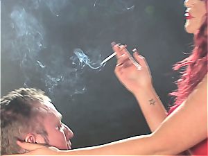 red-haired slut predominates a dude while smoking